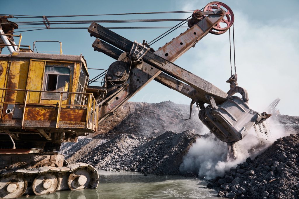 Quarry bucket excavator works in a slag dump